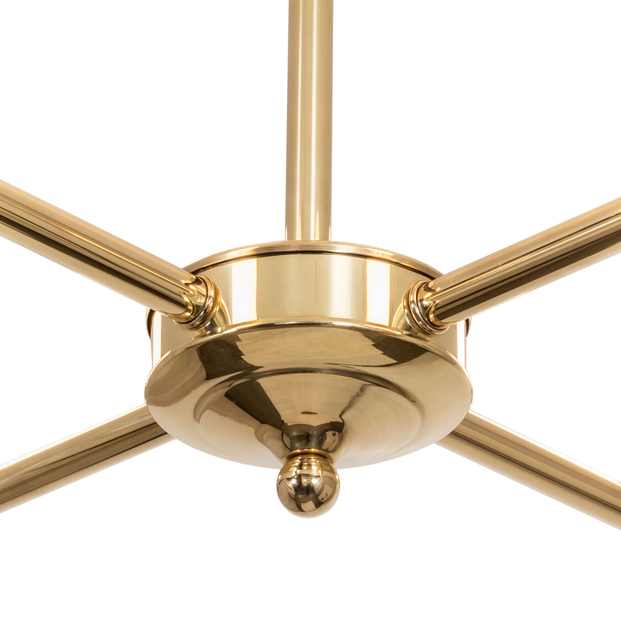 Close-up of chandelier’s polished brass base and rod.