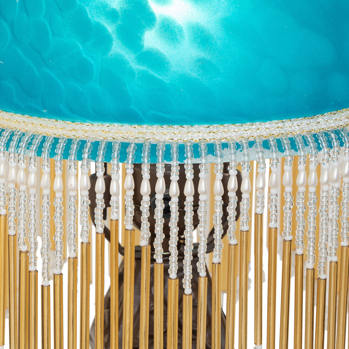 Close-up of the Roussillon Cherub Mini Lamp’s intricate glass beaded fringe and shade details.
