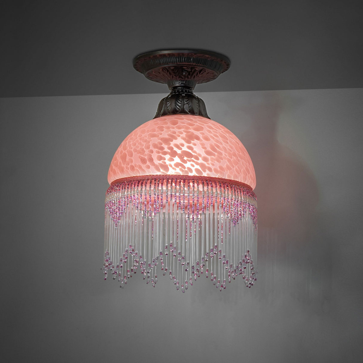illuminated dark view of roussillon flushmount with Victorian elegance.