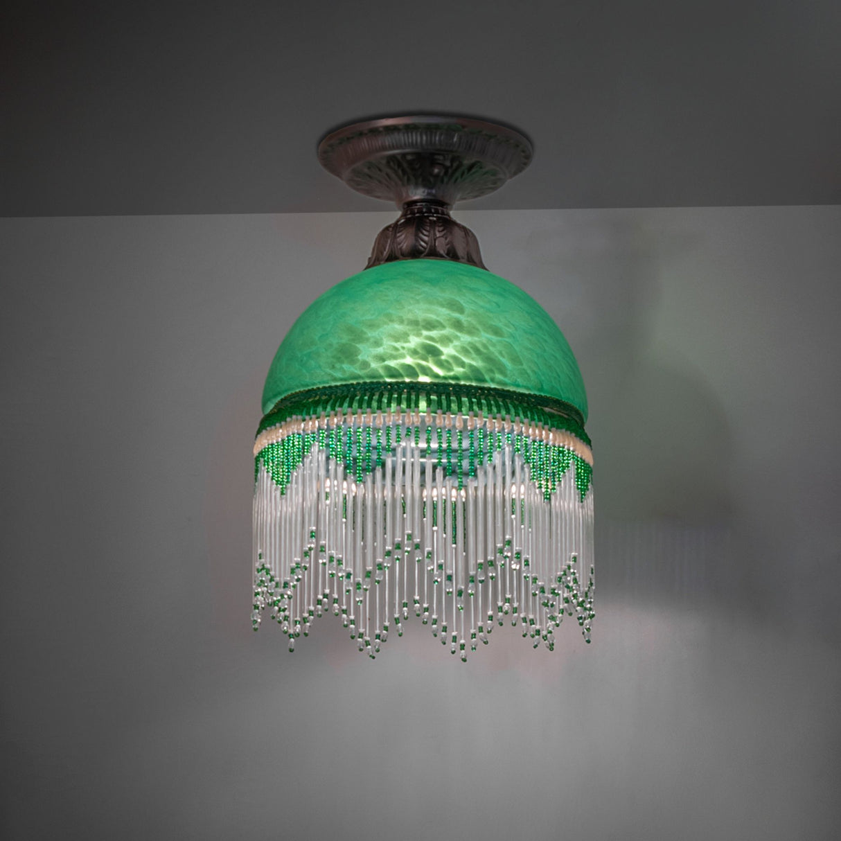 illuminated dark view of roussillon flushmount with Victorian elegance.