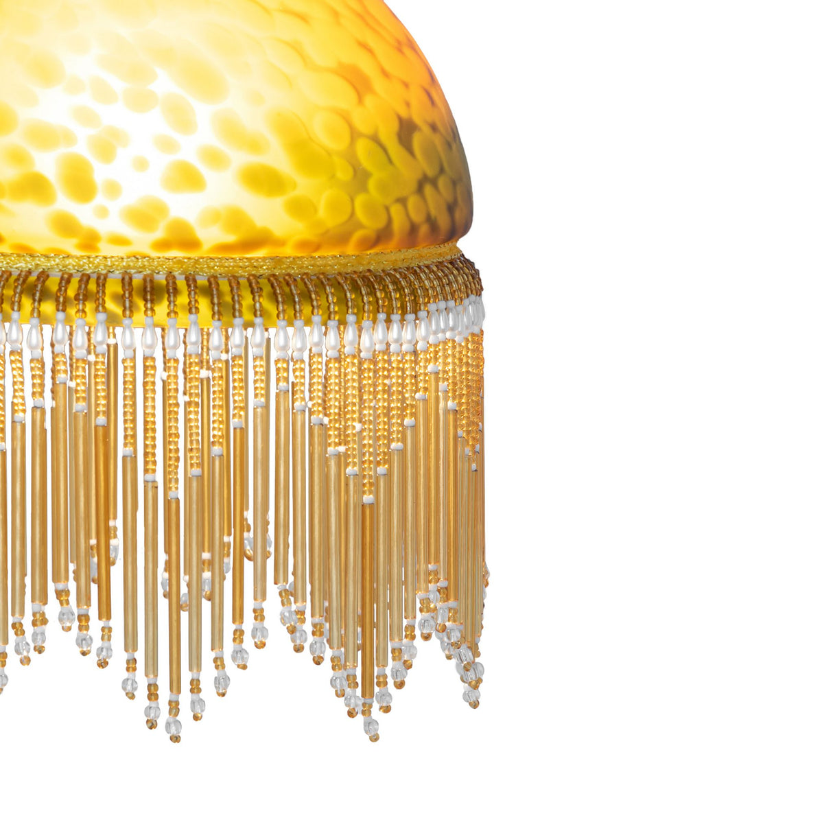 Closeup of amber beaded fringe and mottled glass pendant shade.
