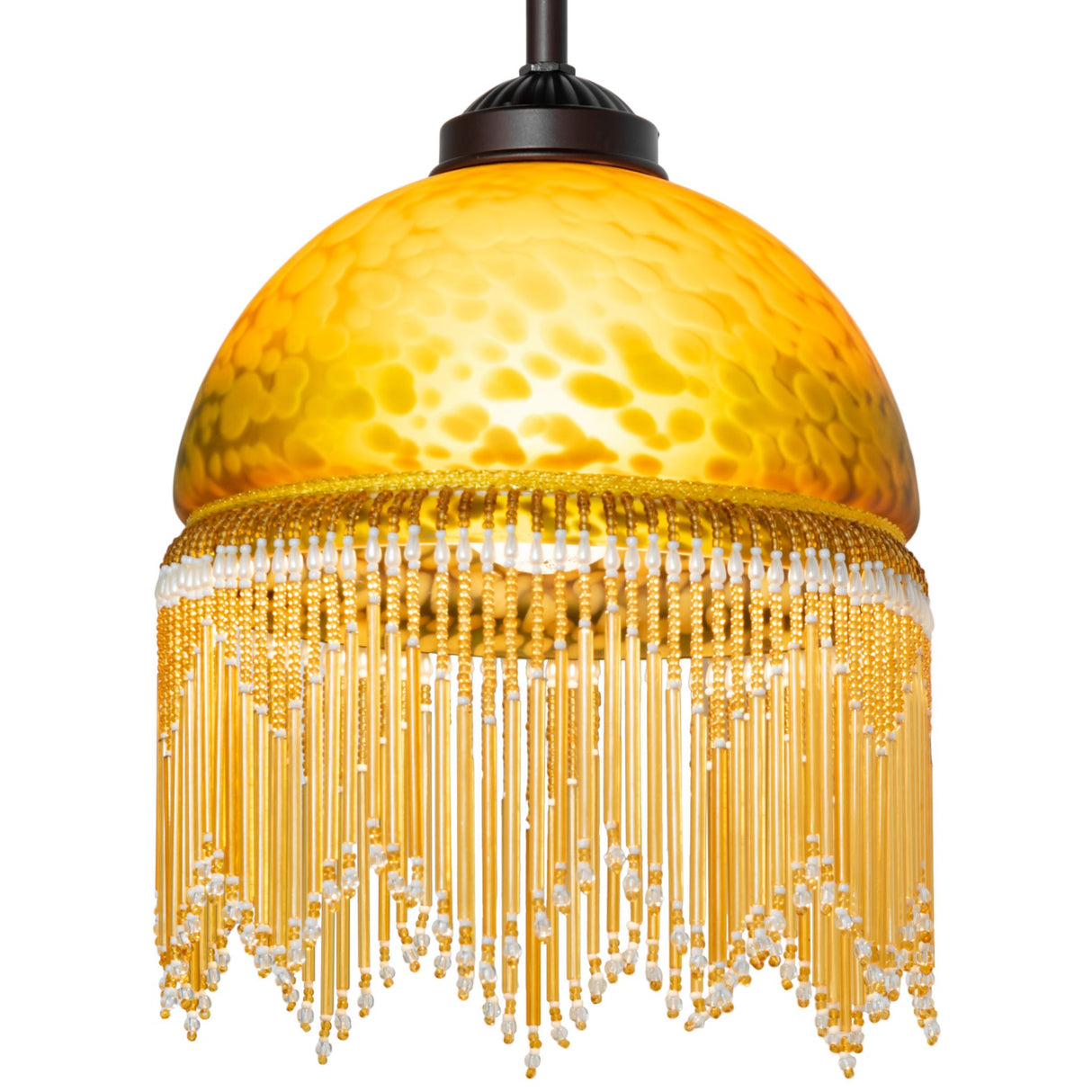 Illuminated amber mottled glass mini pendant casting warm glow.
