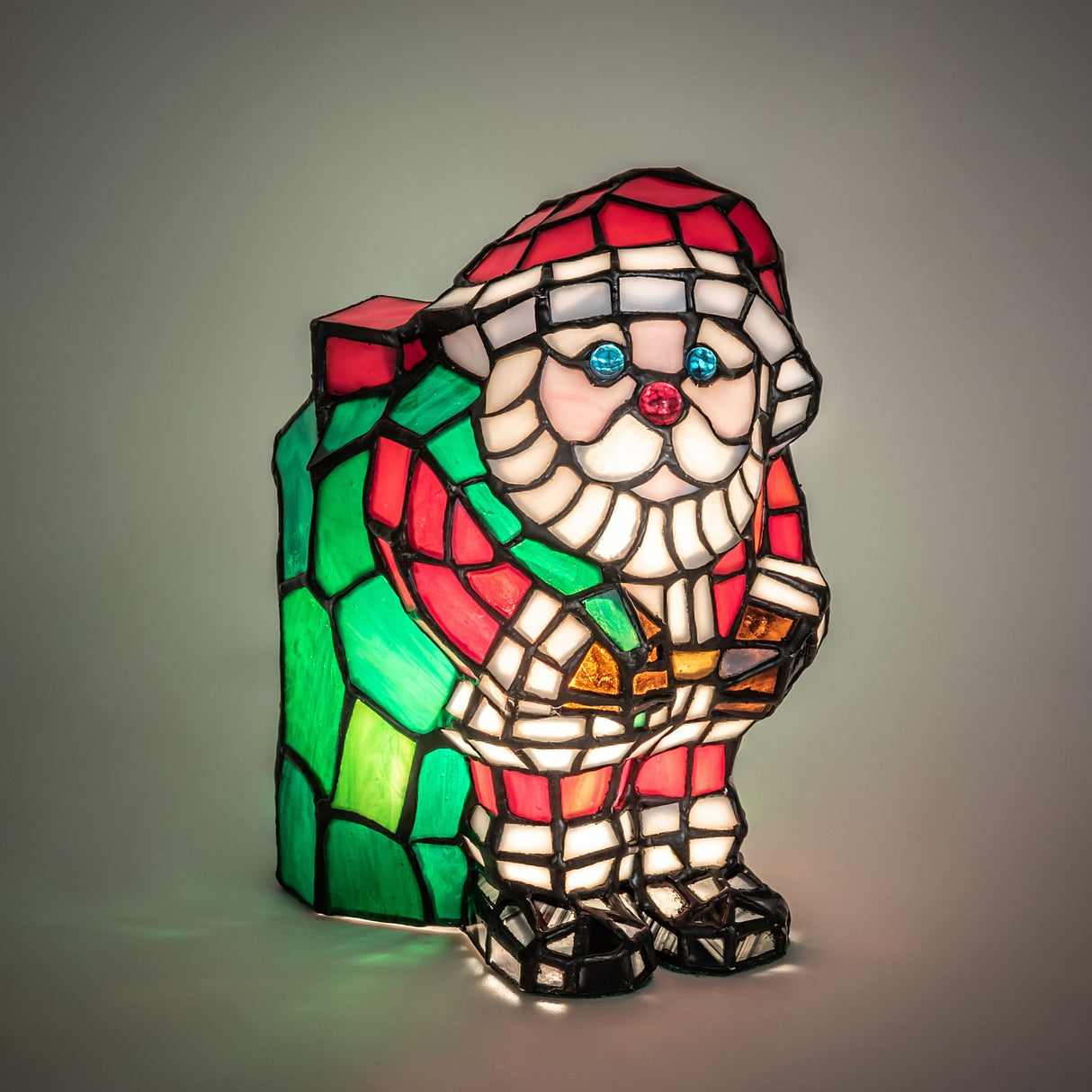 Illuminated Santa Claus stained glass lamp with a warm festive glow.