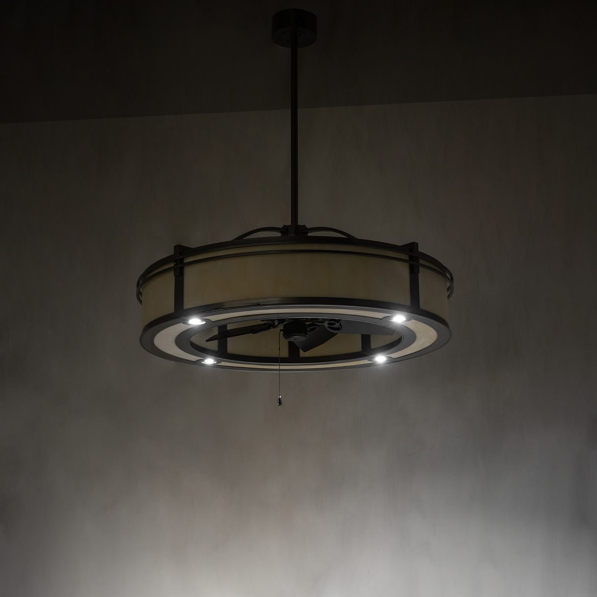 Dimly lit view highlighting subtle glow and downlight effect of chandelier fan.