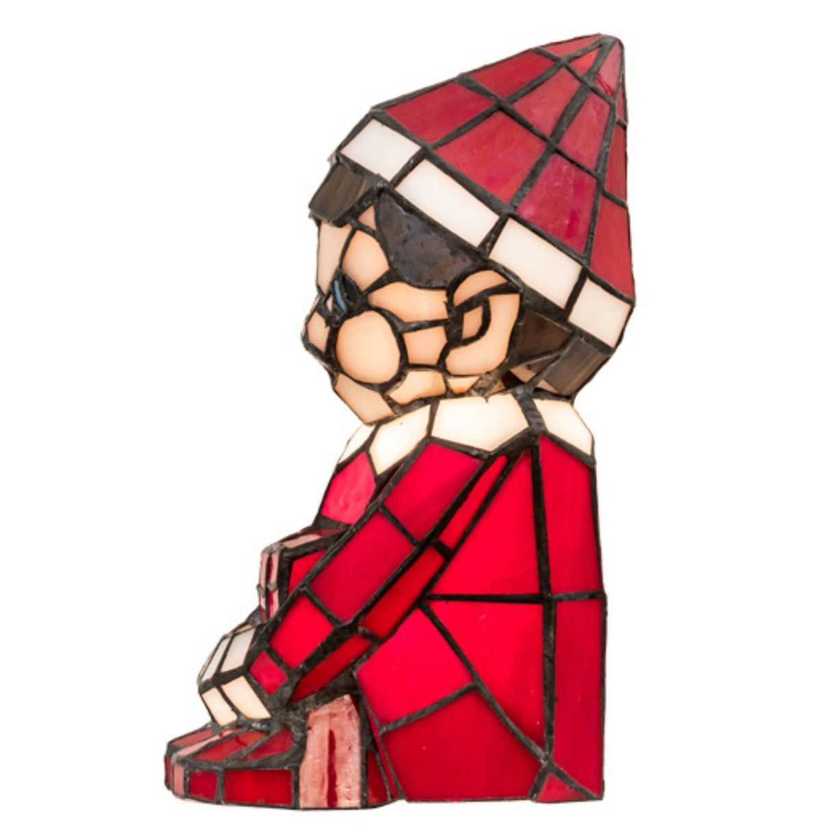 Side profile of a red and white stained glass elf lamp.