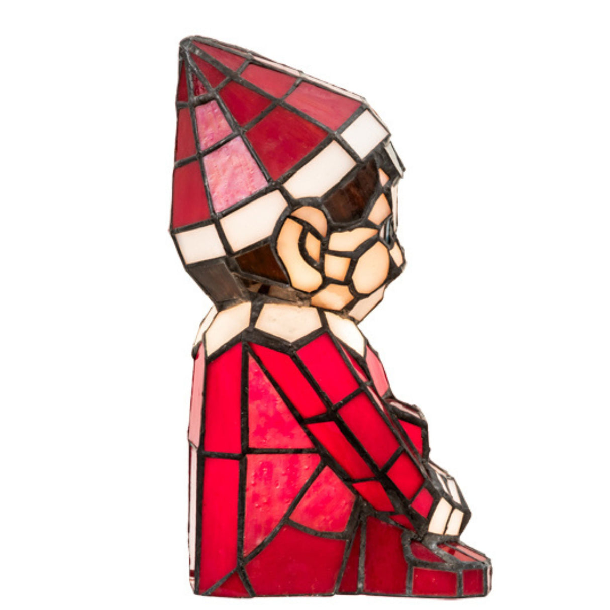 Side view of red and white stained glass elf lamp.