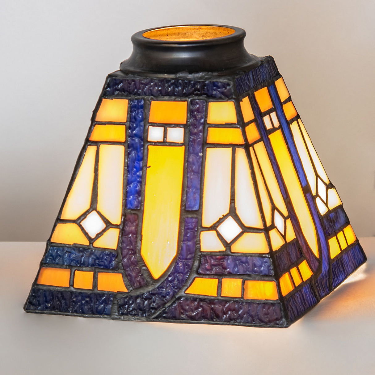Illuminated Sierra Prairie Mission glass shade showcasing warm tones.