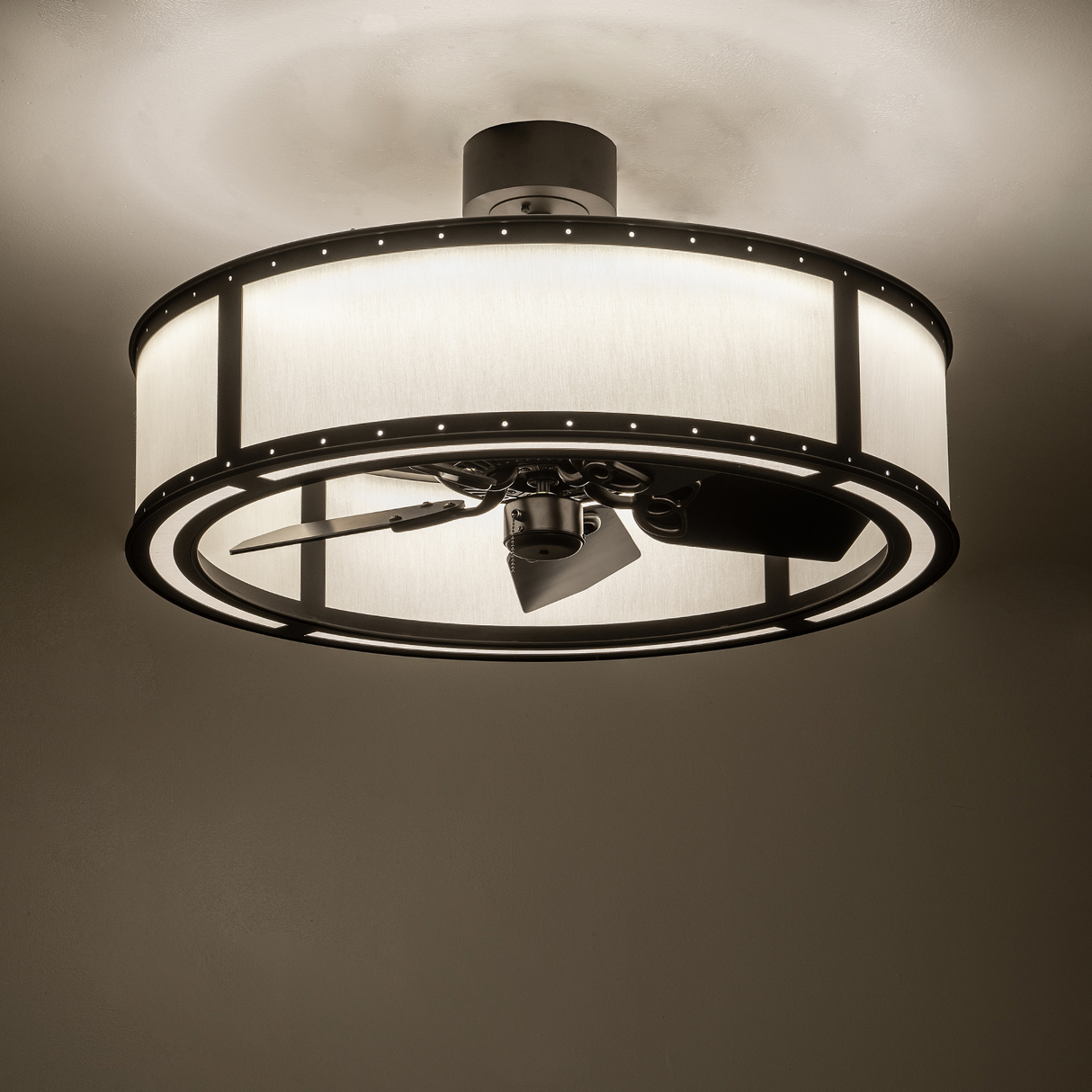 Smythe Craftsman Chandel-Air casting warm ambient light in room setting.