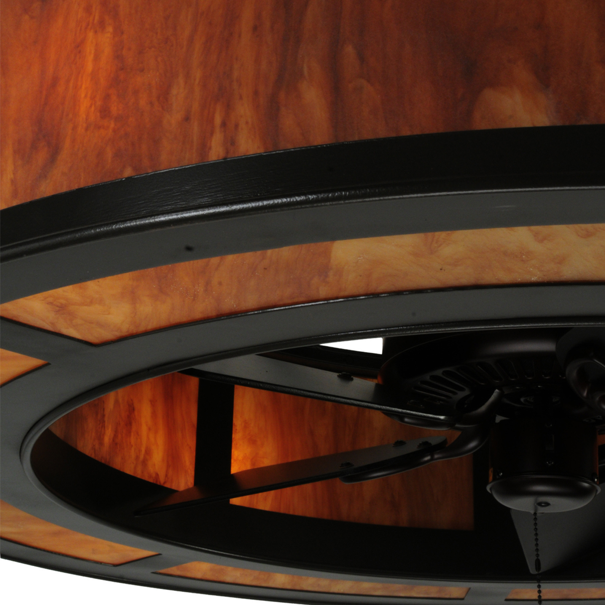Close-up of Ambra Siena Idalight diffuser glowing softly in bronze Craftsman frame.