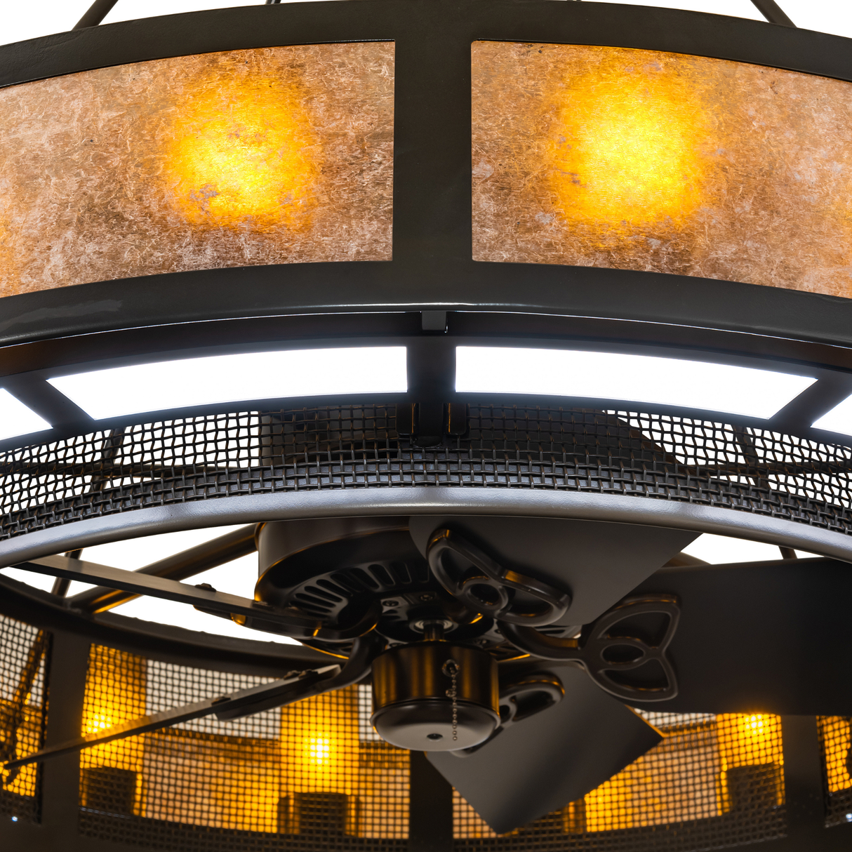 Close-up highlighting glowing mica diffuser and fan texture.