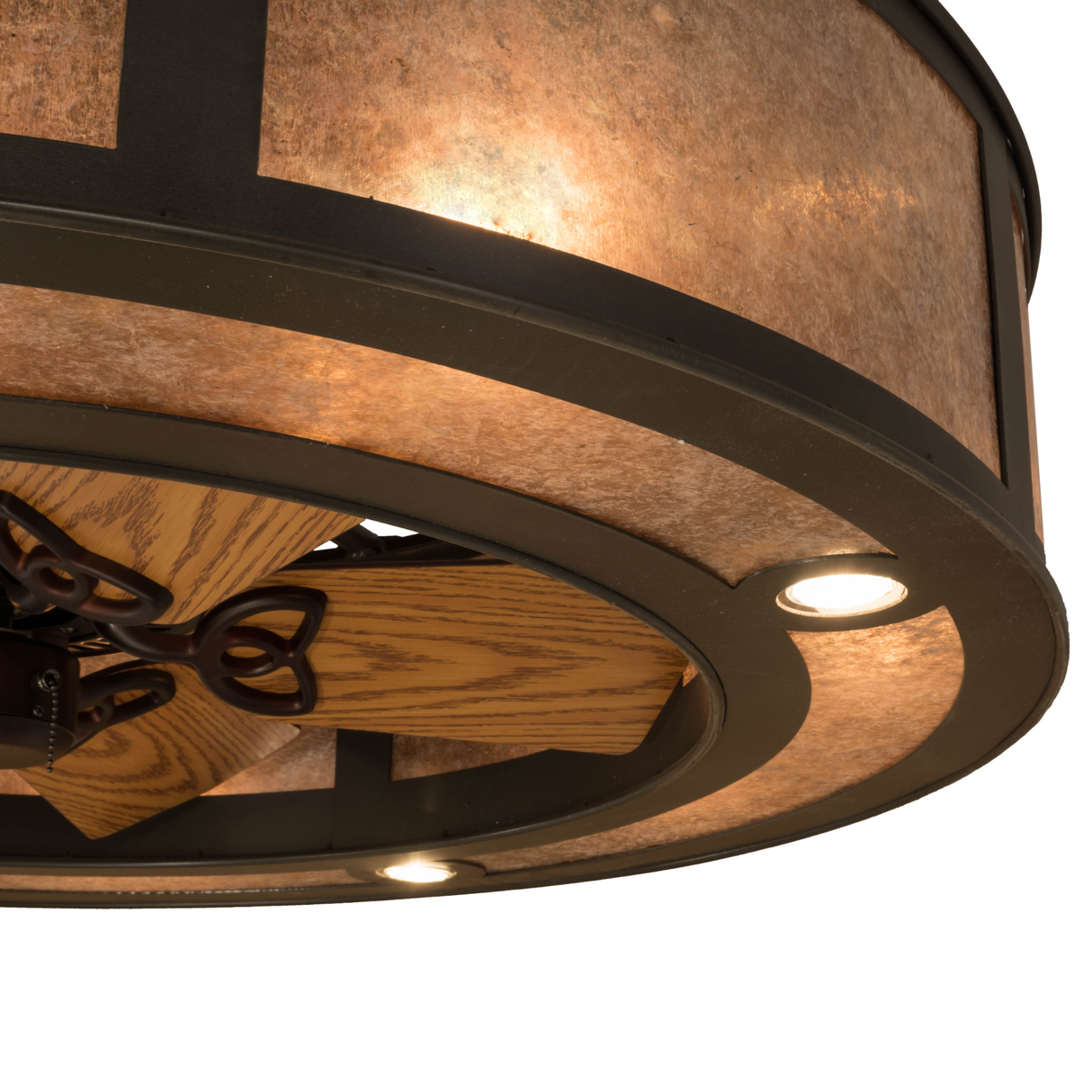 Closeup lit view highlighting fan detail and bronze structure.
