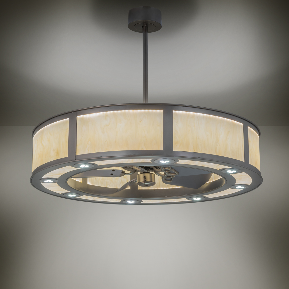 Ambient lit view of Smythe Craftsman Chandel-Air glowing softly in a modern room.