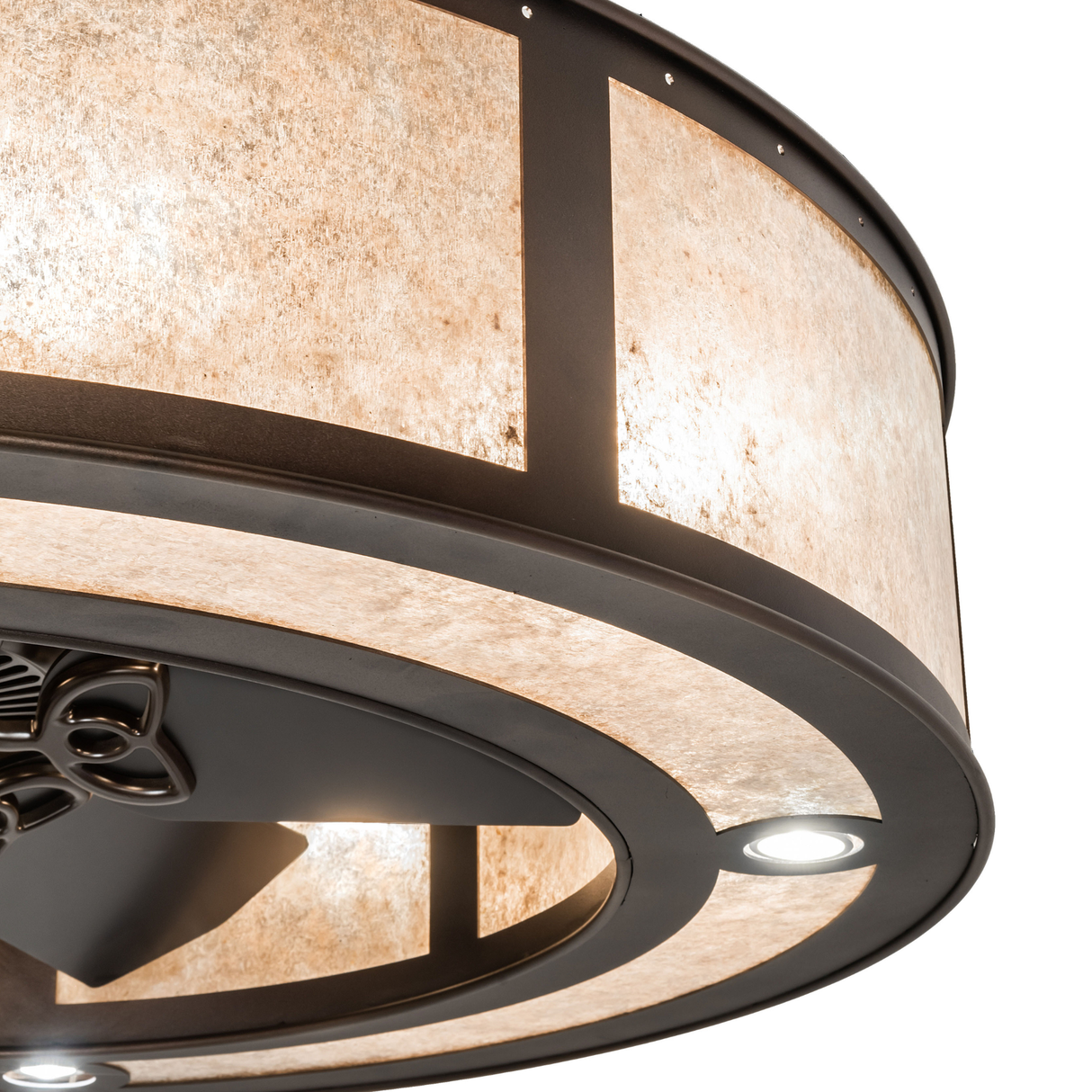 Detailed mica diffuser glowing softly against bronze frame.