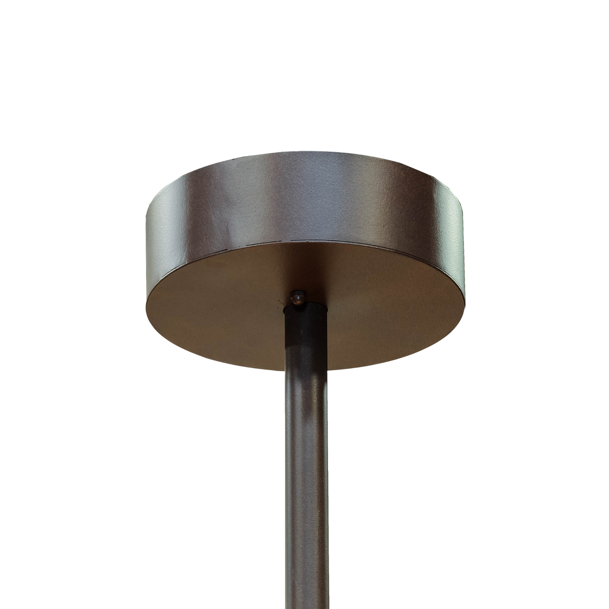 Closeup of round ceiling canopy with dark bronze finish.