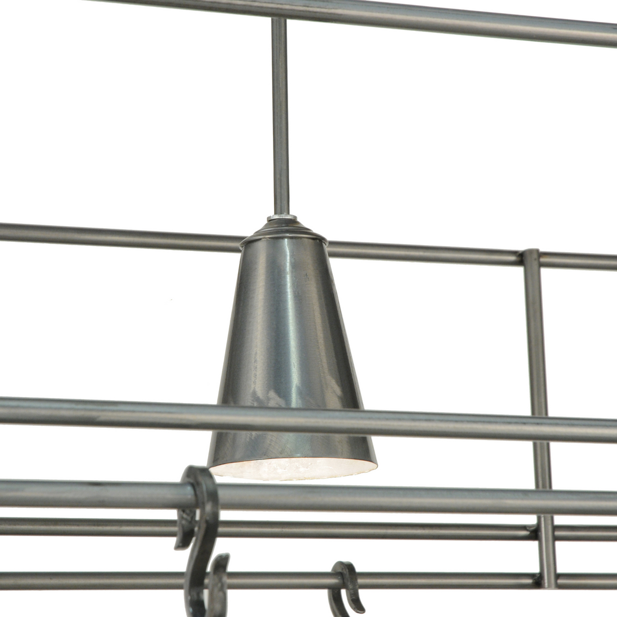Close-up of spotlight on contemporary pot rack frame.