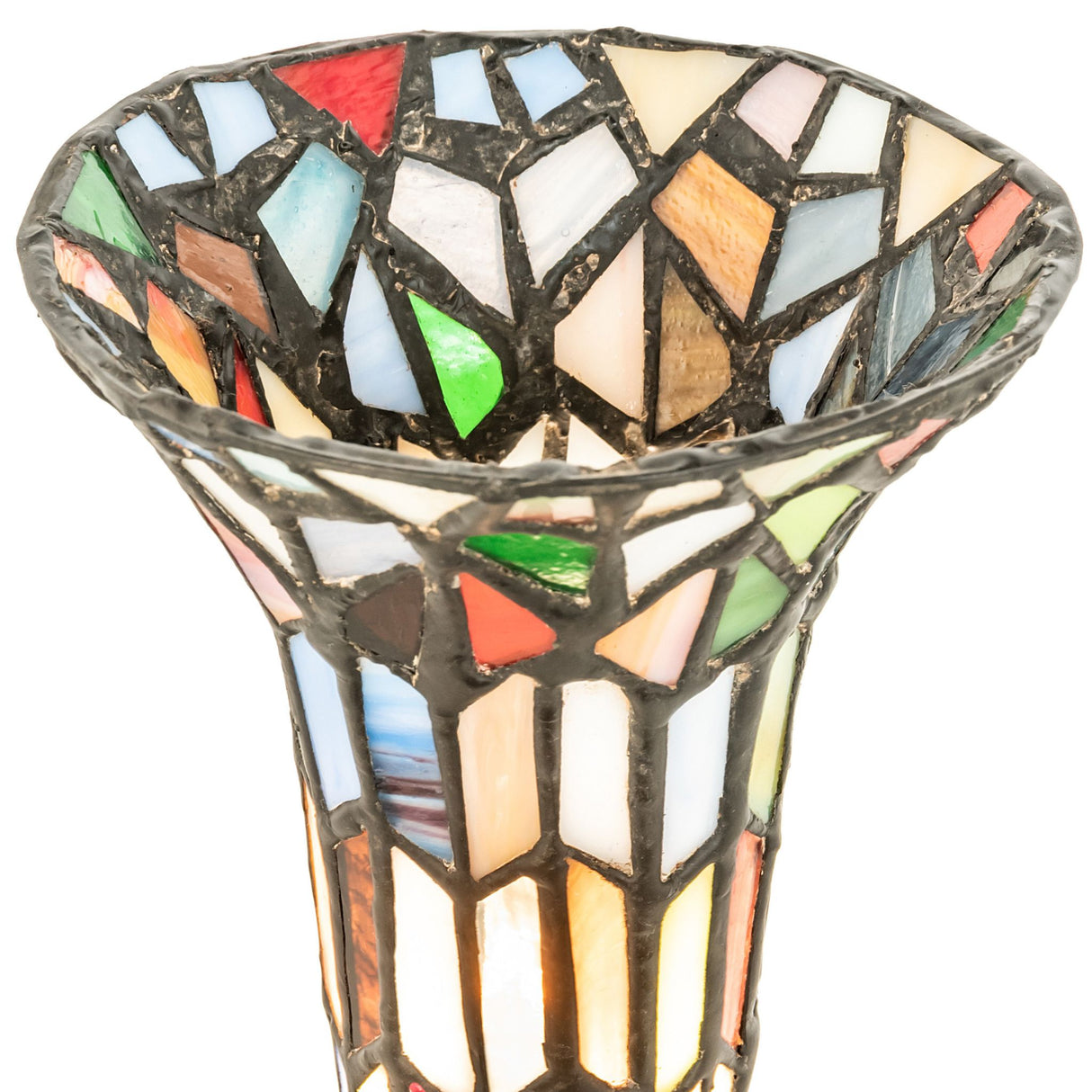Closeup of handcrafted multicolor stained glass lily shade.