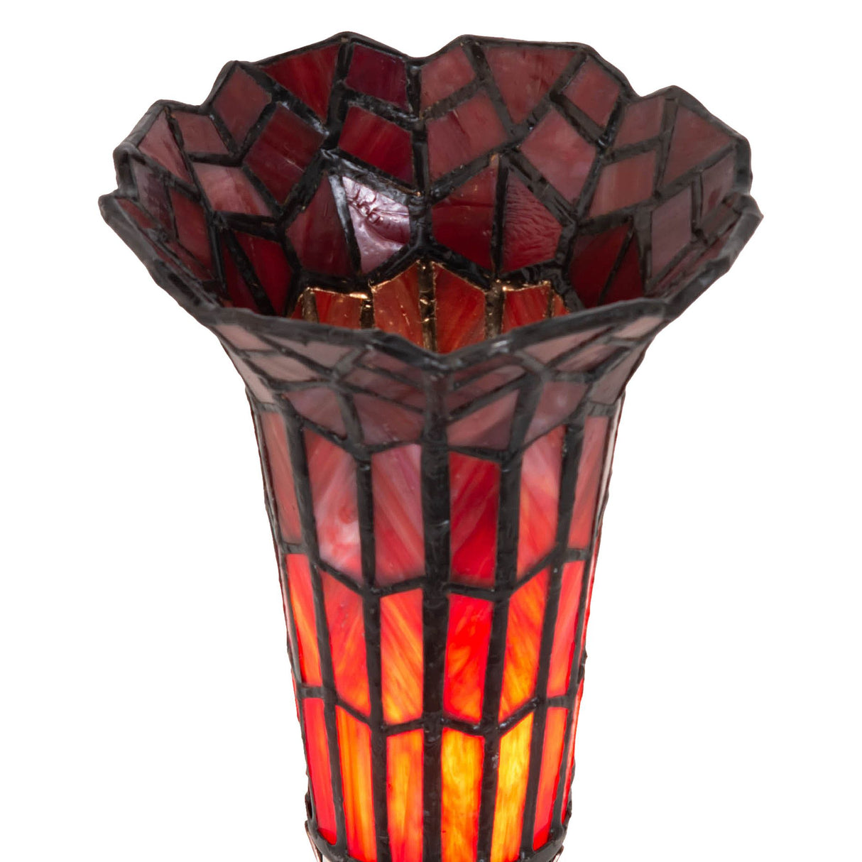 Close-up of the red stained glass shade of a pond lily Victorian accent lamp.