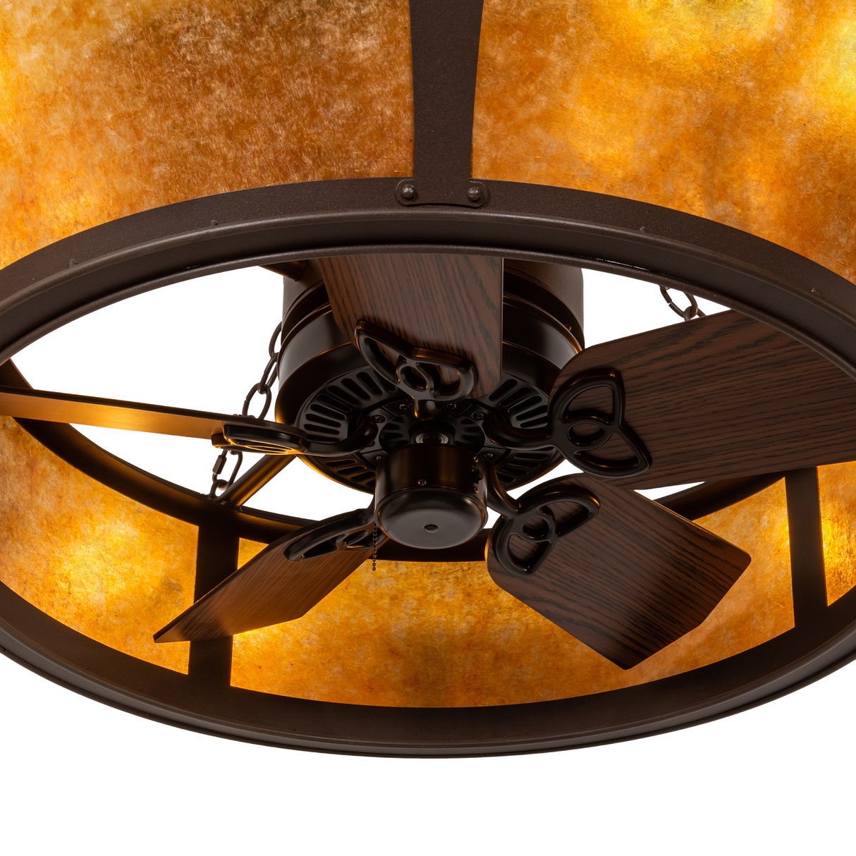 Close-up of fan blades beneath illuminated amber mica panels.