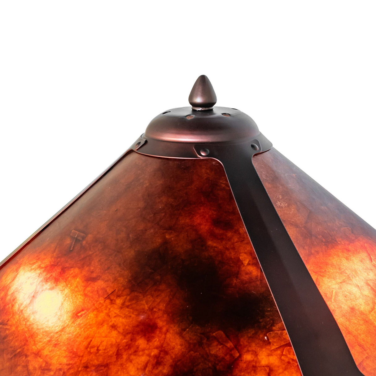 Close-up of Sutter table lamp's amber mica shade top with bronze finial.