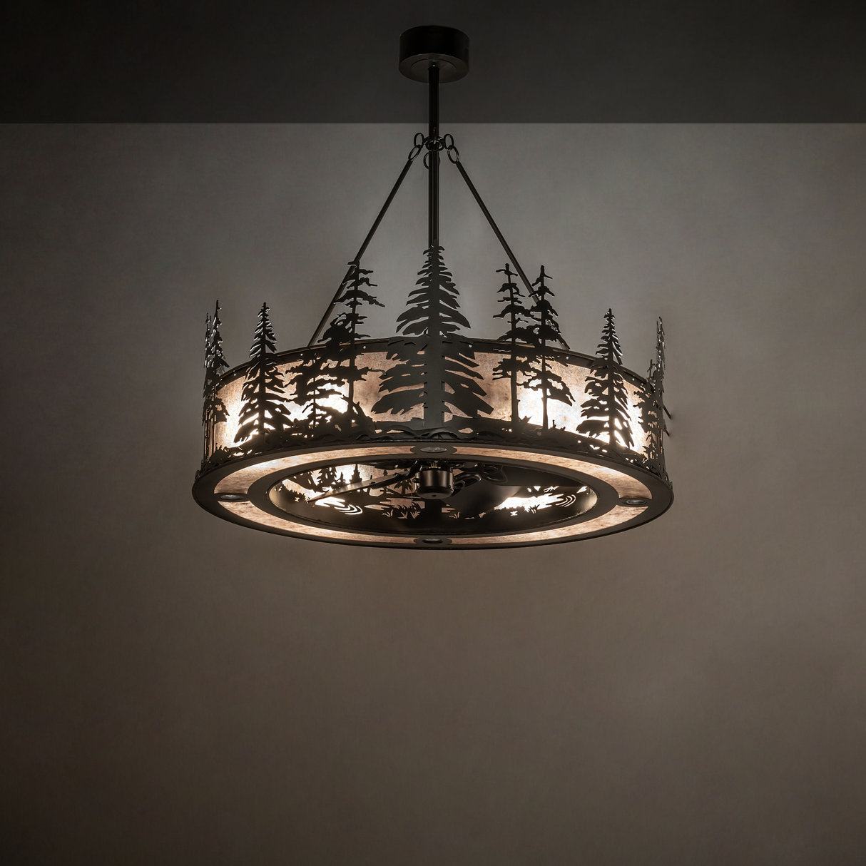 Tall Pines Chandel-Air softly glowing with forest silhouette in warm ambient light.