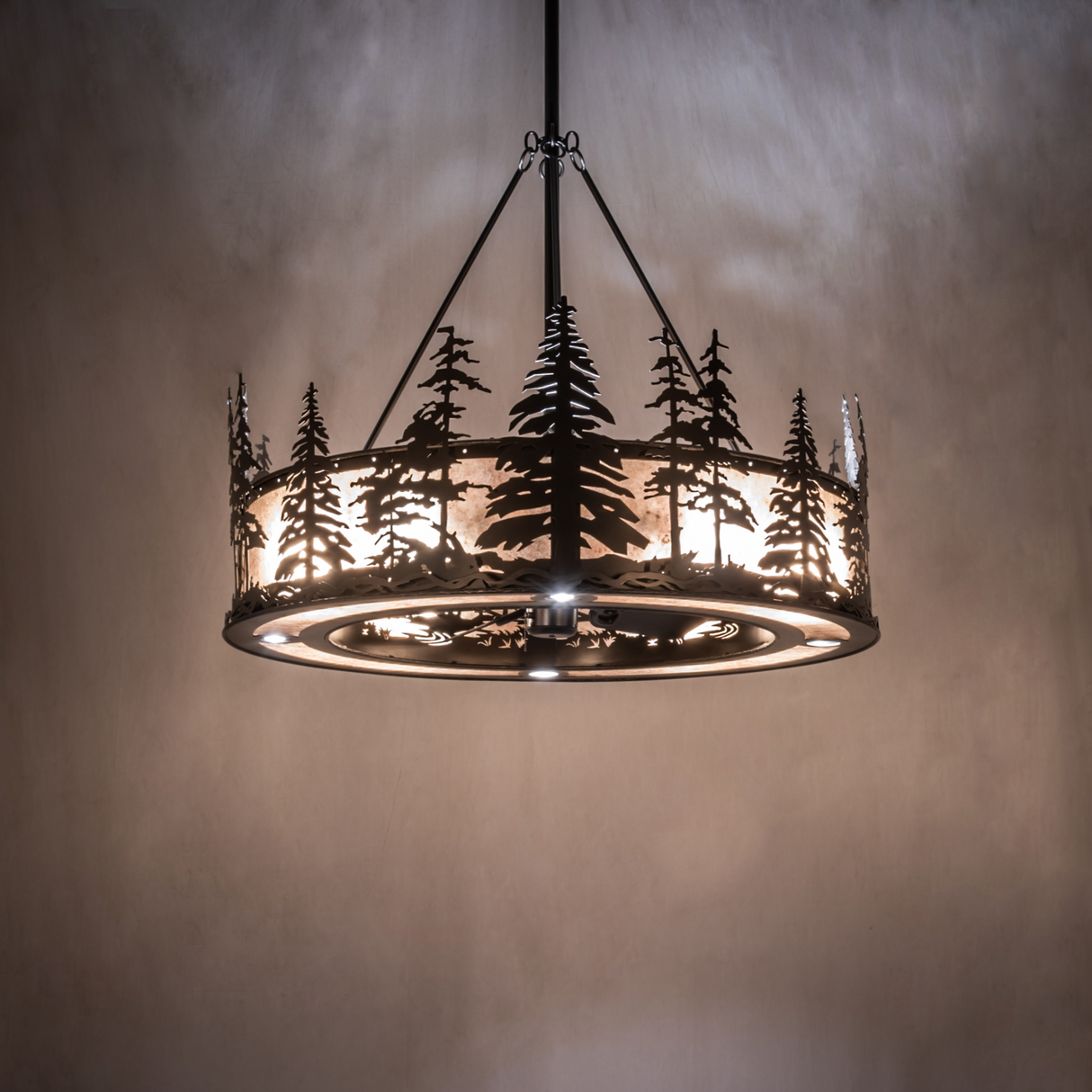 Tall Pines chandelier fan softly lighting a rustic lodge-style room.
