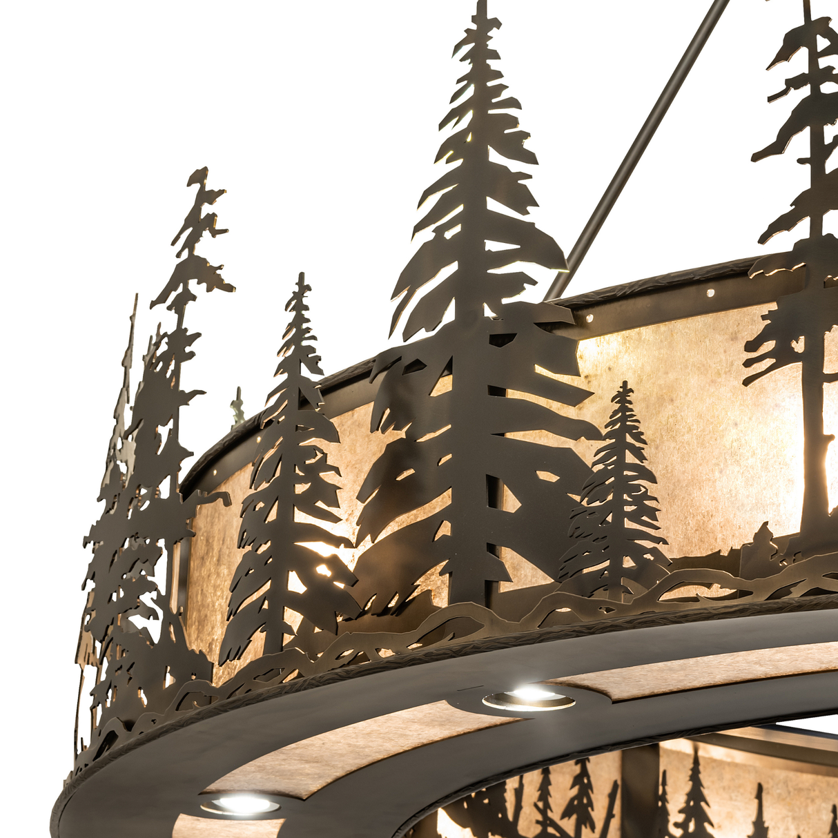 Close-up of pine tree cutouts illuminated through mica diffuser.