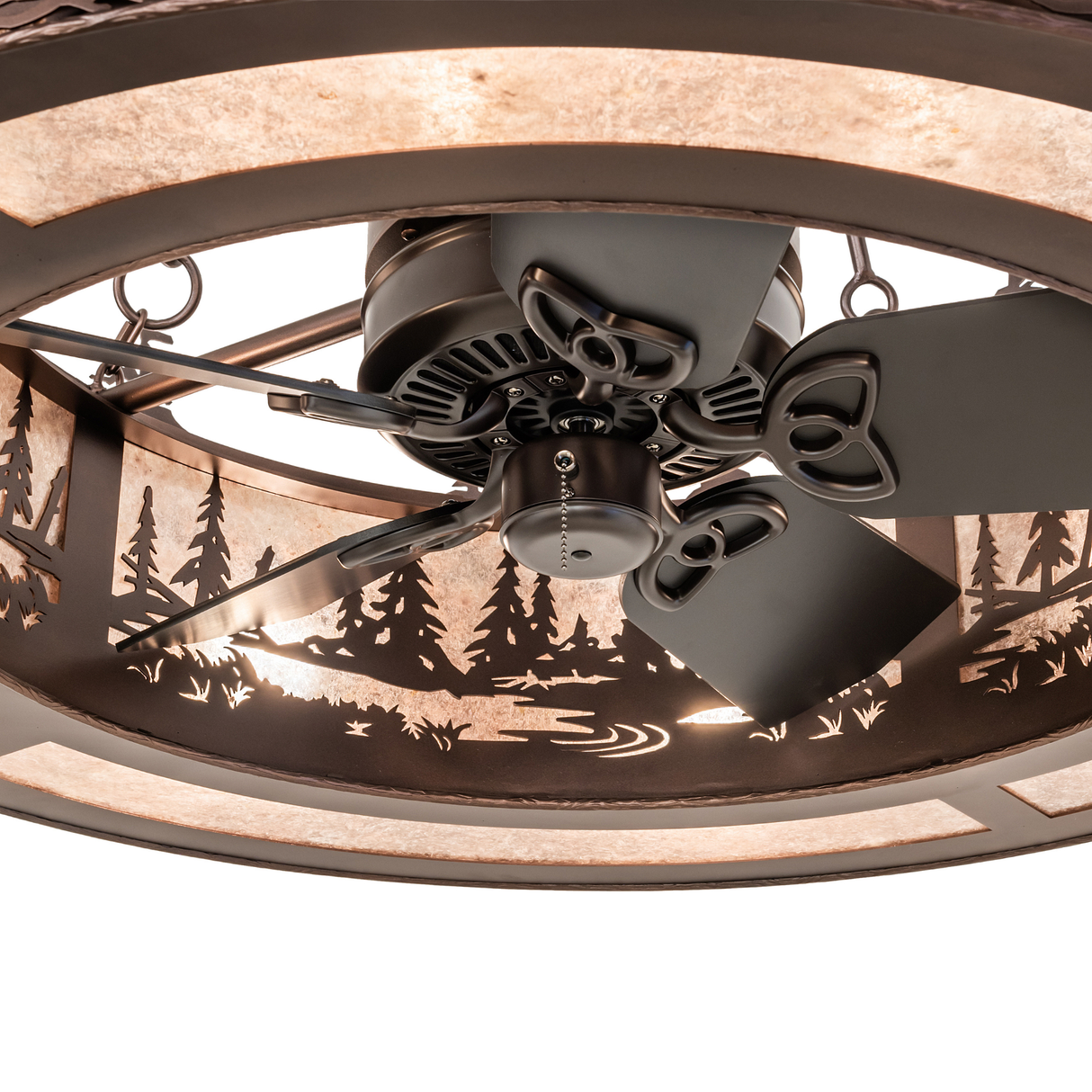 Close-up of fan motor and tree-patterned diffuser panel.