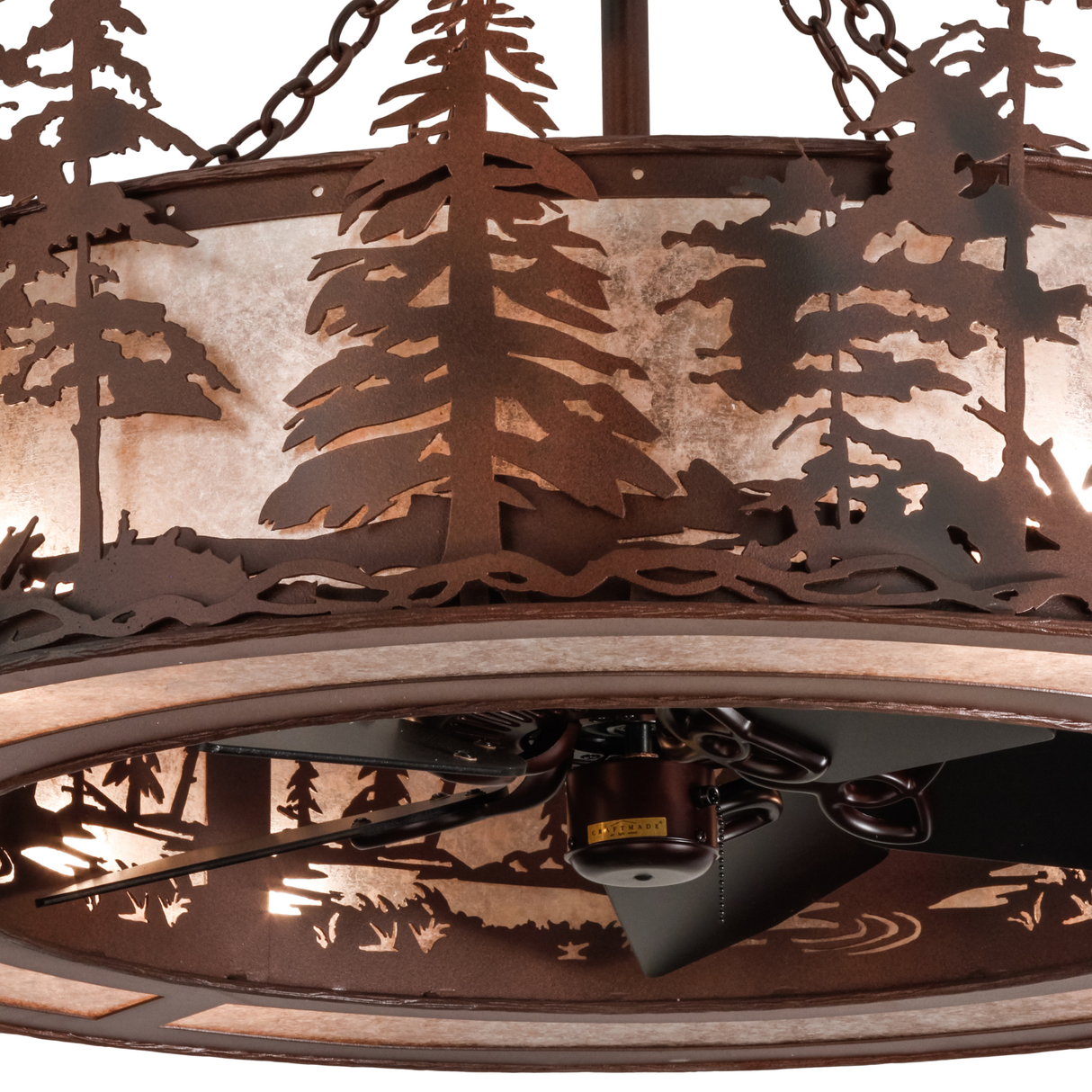 Closeup showing glowing mica panels and pine tree cutout detail.