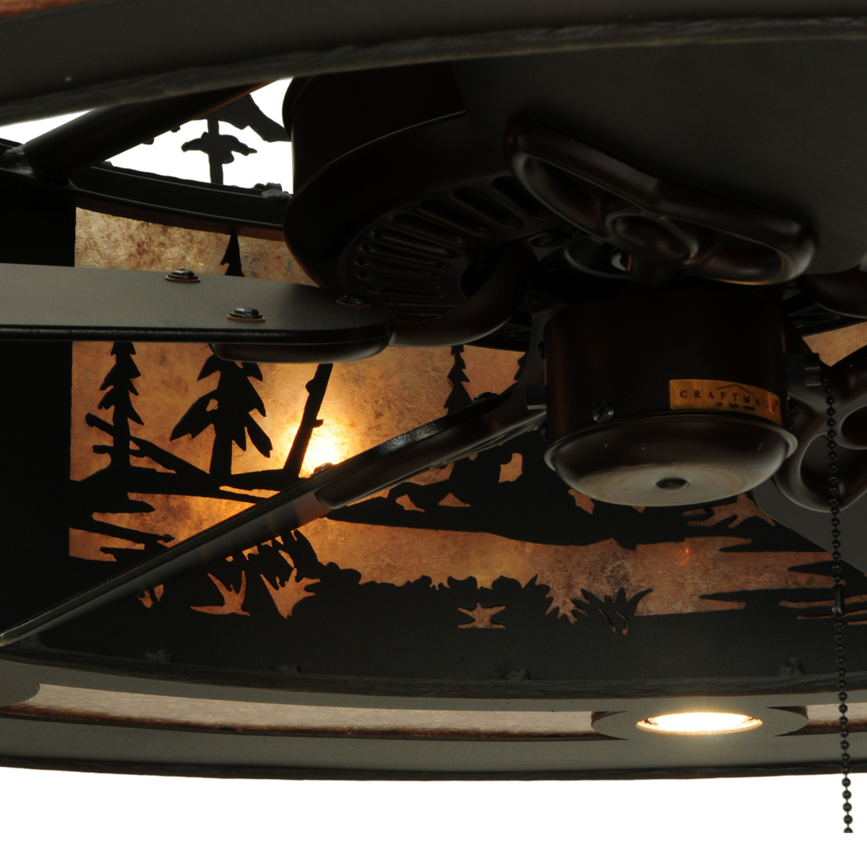 Close-up showing fan motor and forest pattern illuminated on Tall Pines Chandel-Air.