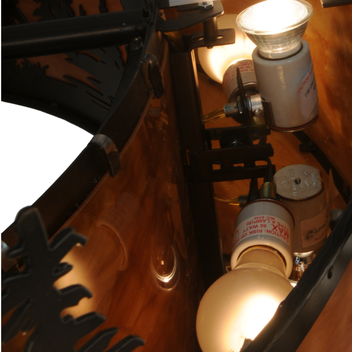 Closeup showing glowing bulbs and inner lighting assembly.