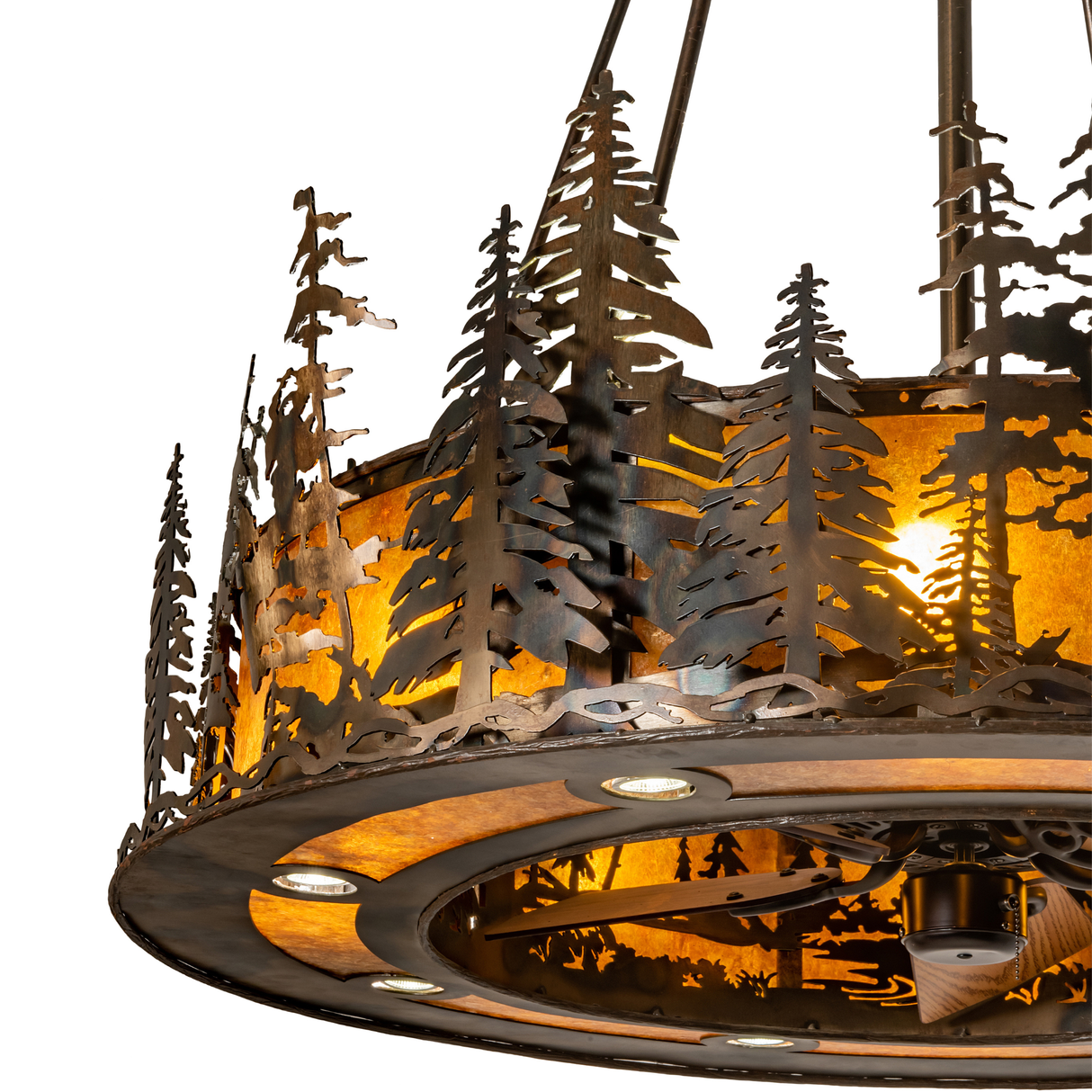 Close-up of pine tree cutouts over amber mica diffuser.