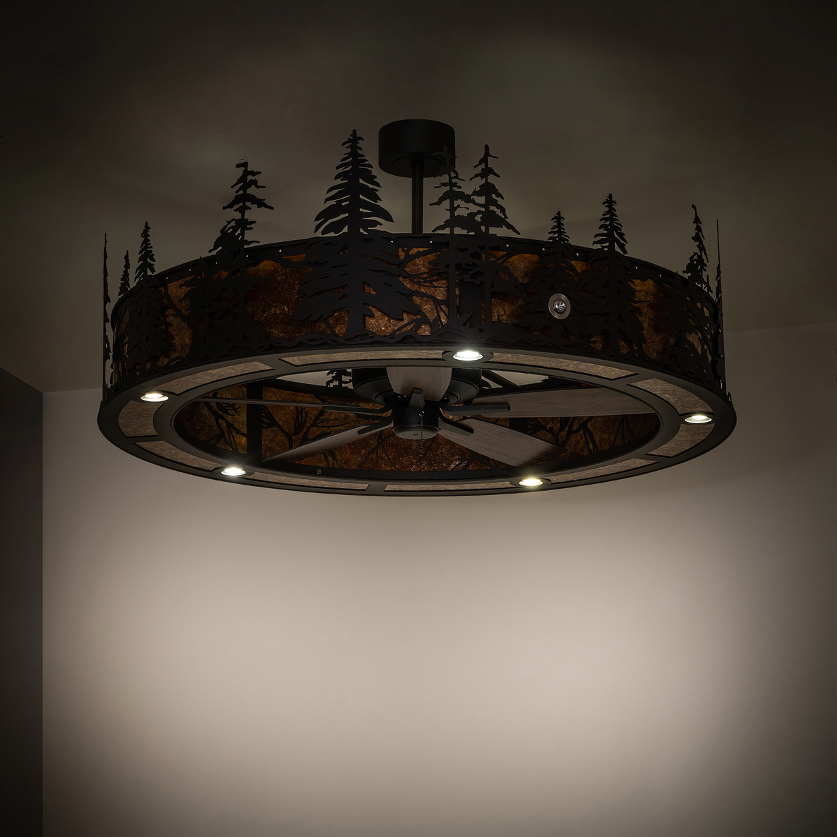 Subtle room lighting view with illuminated pine tree cutouts and warm glow.