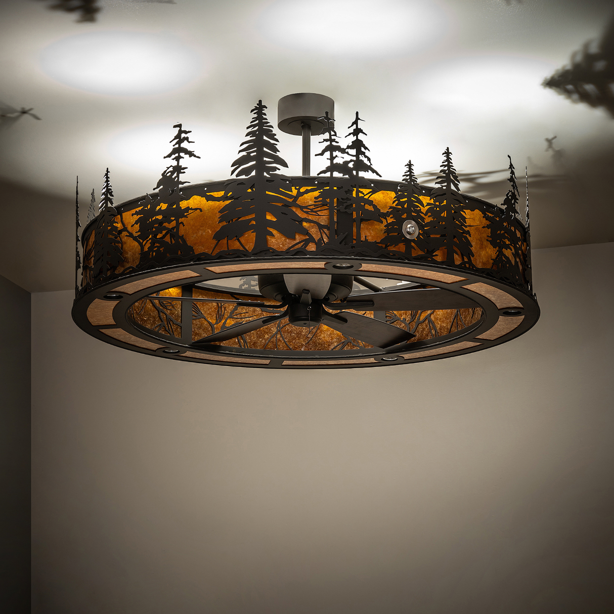 Ambient lit view of chandelier fan casting soft warm light on ceiling