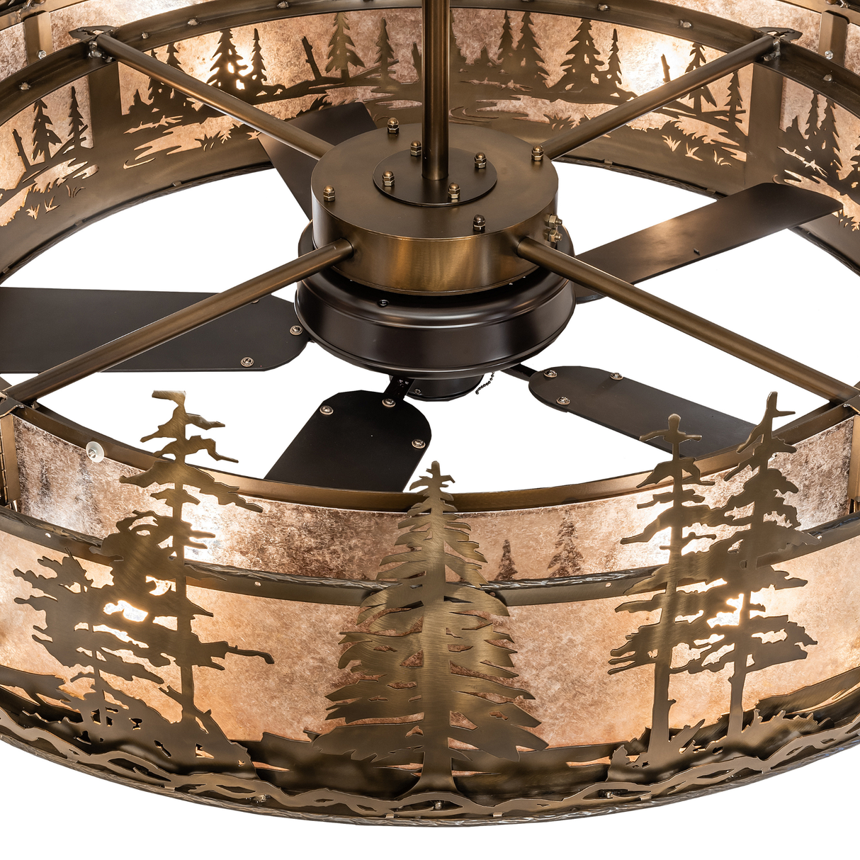 Upper tier detail showing layered pine cutouts and antique copper finish.