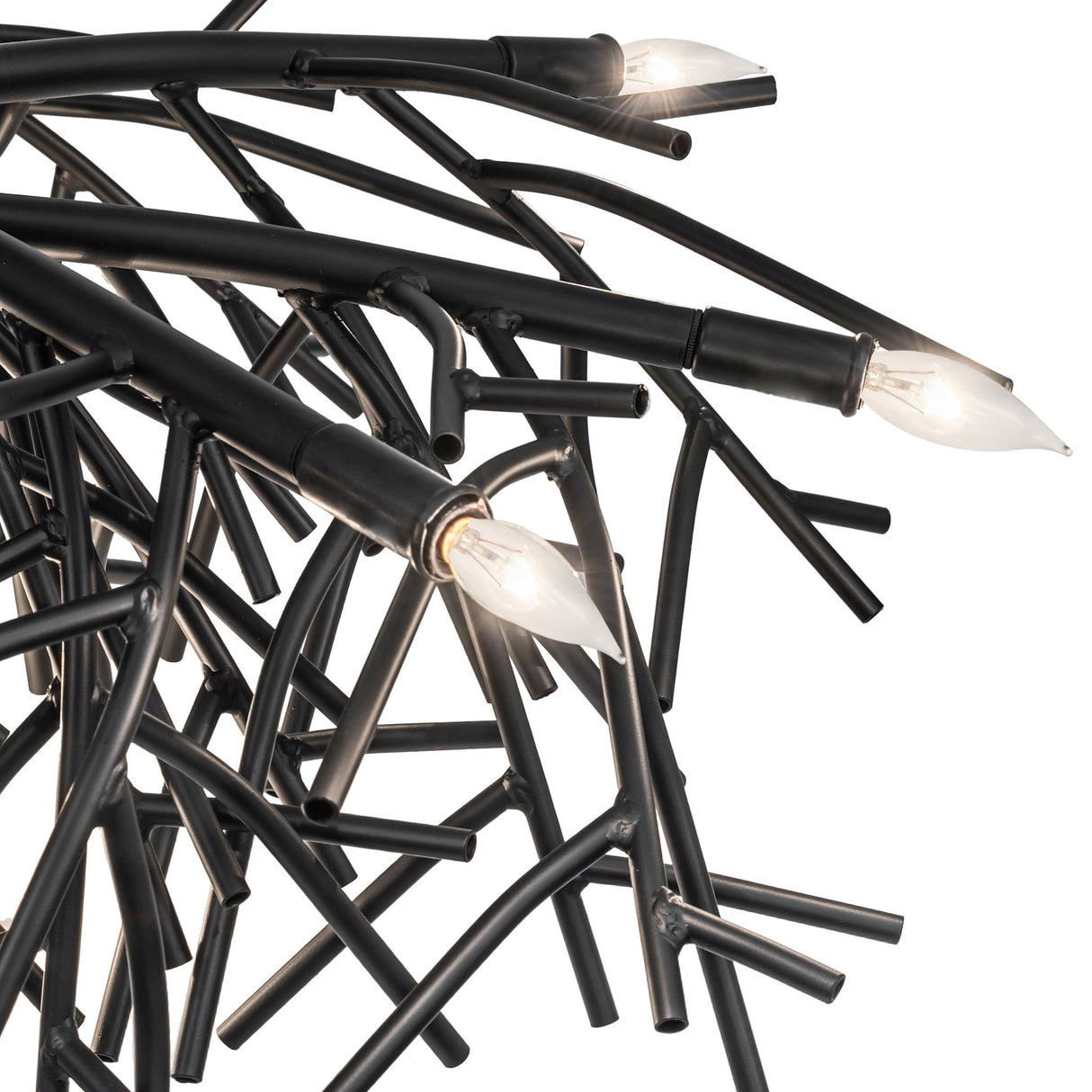 Detailed view of Thicket chandelier light arms with branch-inspired metal tubing.