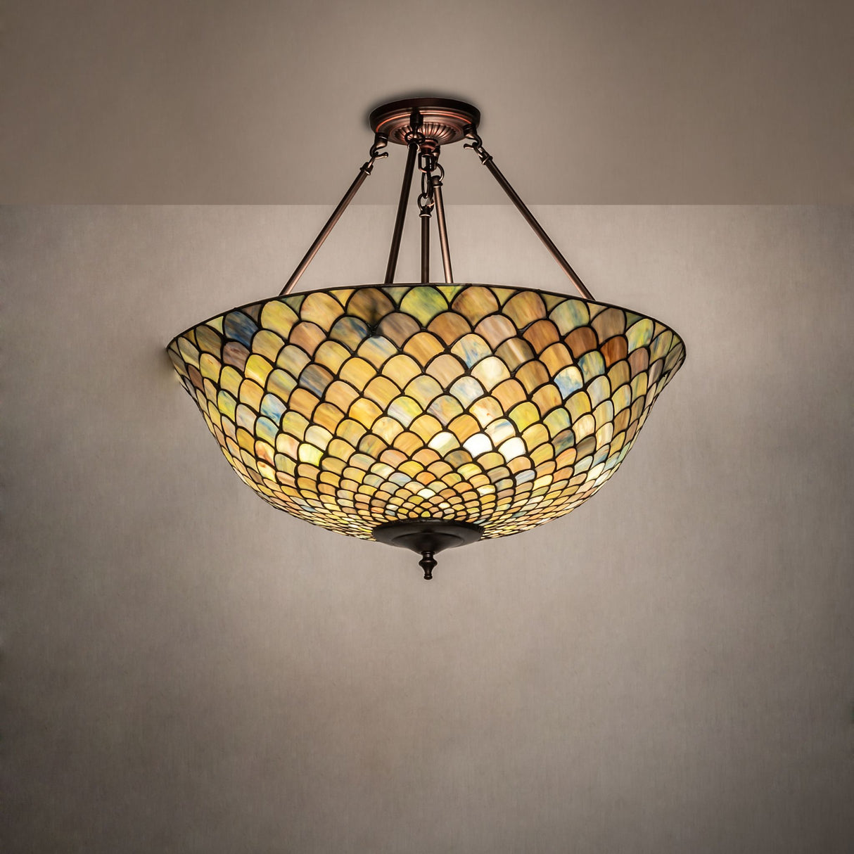 Angled view showing the vibrant Tiffany fishscale semi-flushmount.