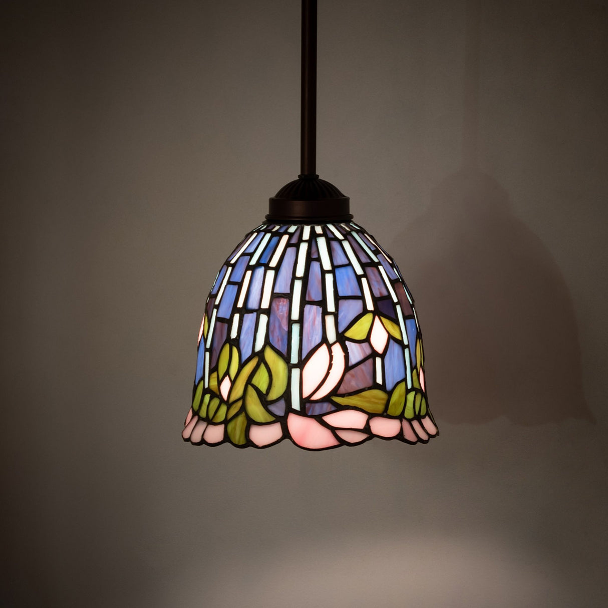 Illuminated view of Tiffany Flowering Lotus Mini Pendant highlighting vibrant stained glass colors.