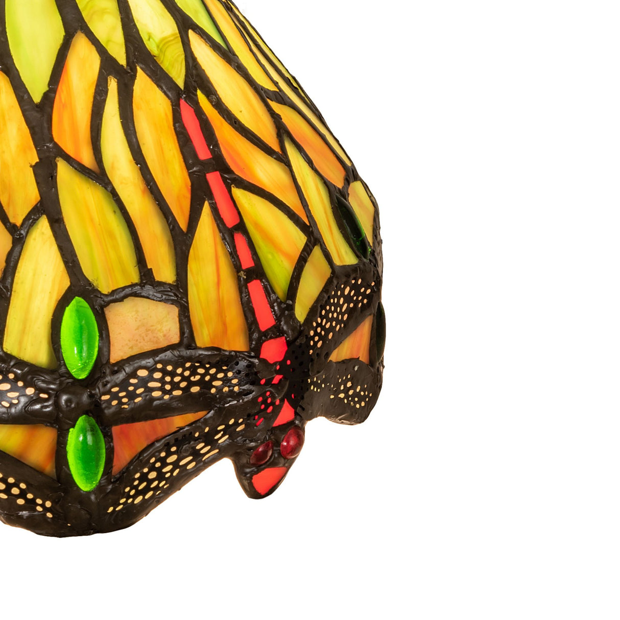 Detailed view of the dragonfly stained glass pattern with red jeweled eyes.