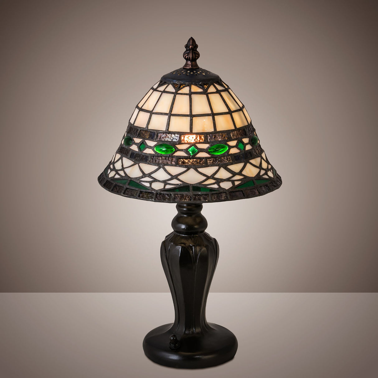 Tiffany Roman mini lamp glowing in a warm ambient setting.