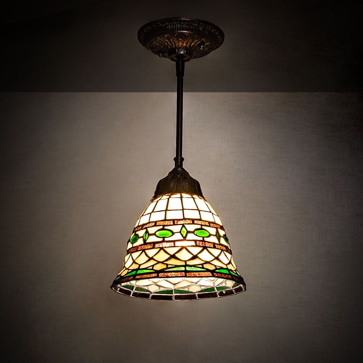 Tiffany Roman Mini Pendant illuminated in a dimly lit setting.