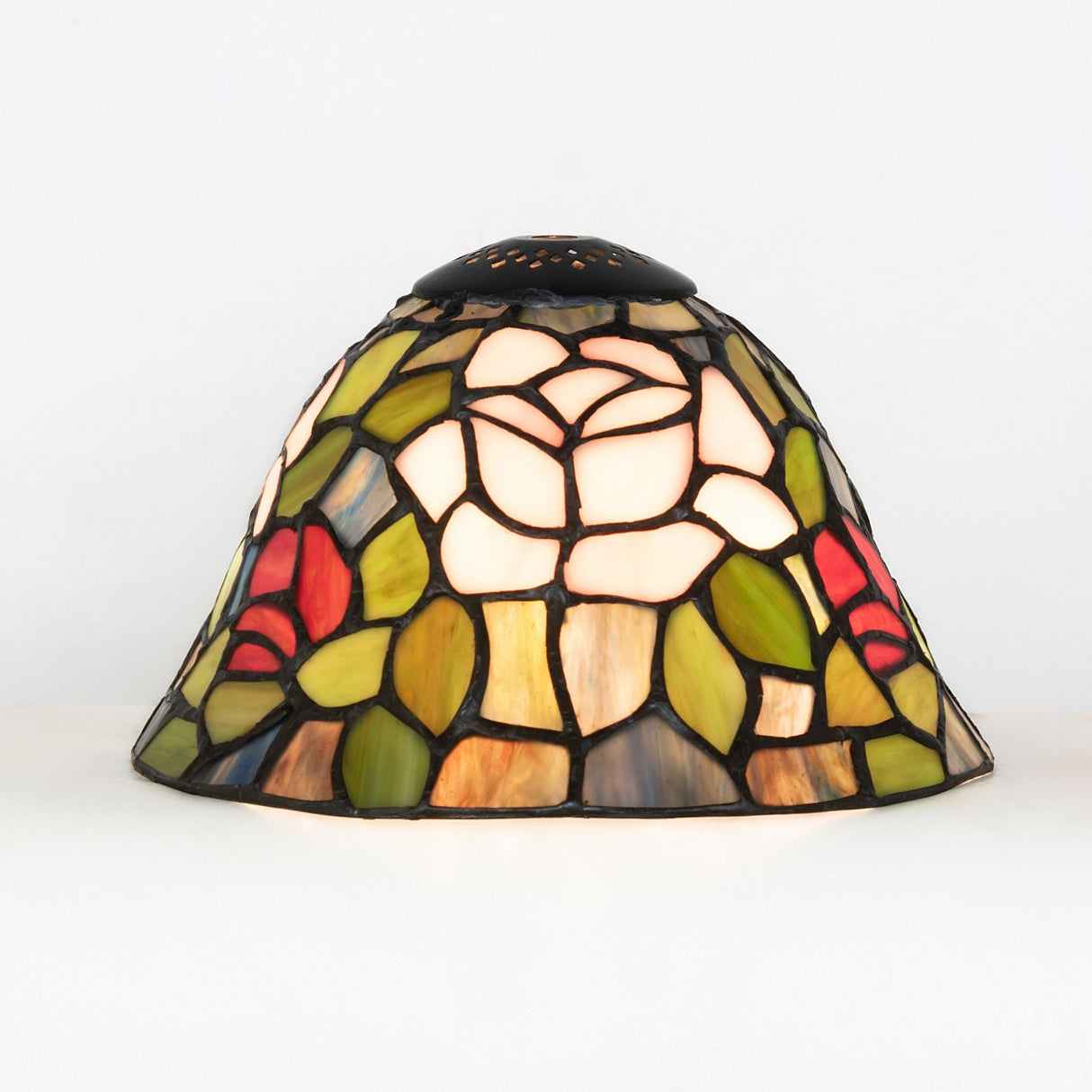 Illuminated Tiffany Rosebush floral glass shade showcasing vivid colors.