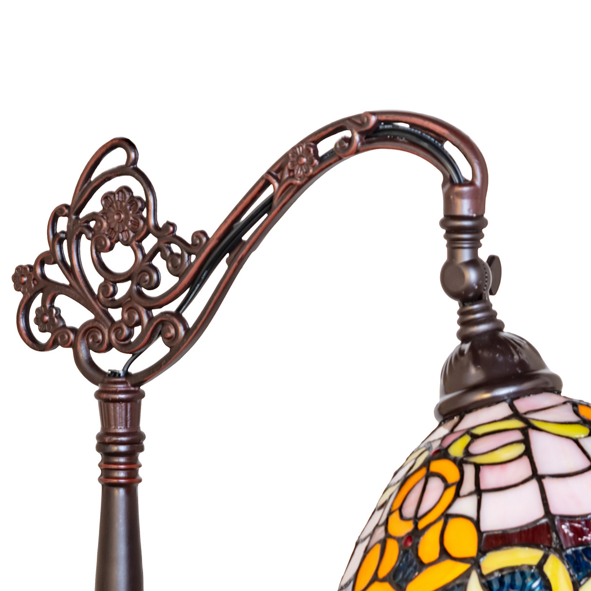 Close-up of ornate bridge arm in antique brass finish.