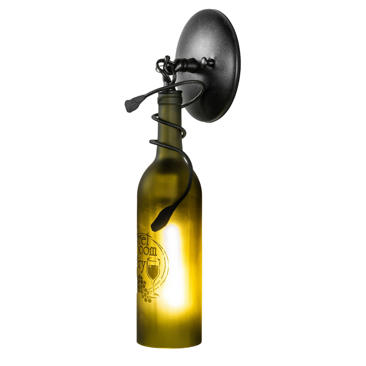 Warm light shining through etched wine bottle sconce.