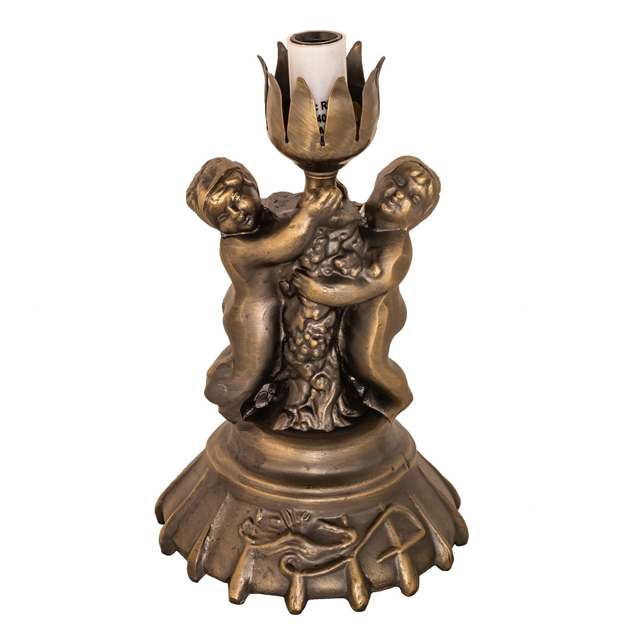 Unlit lamp showcasing twin cherub base and floral crown-shaped holder.