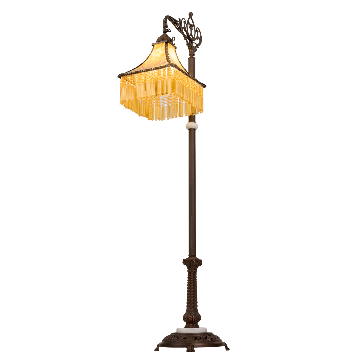 Angled lit view of Victorian glass shade with beaded fringe.