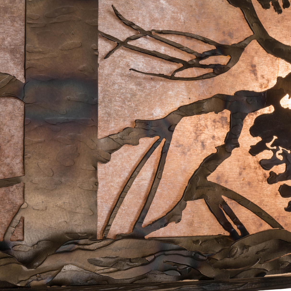 Closeup of Amber Mica shade with pine branch design.