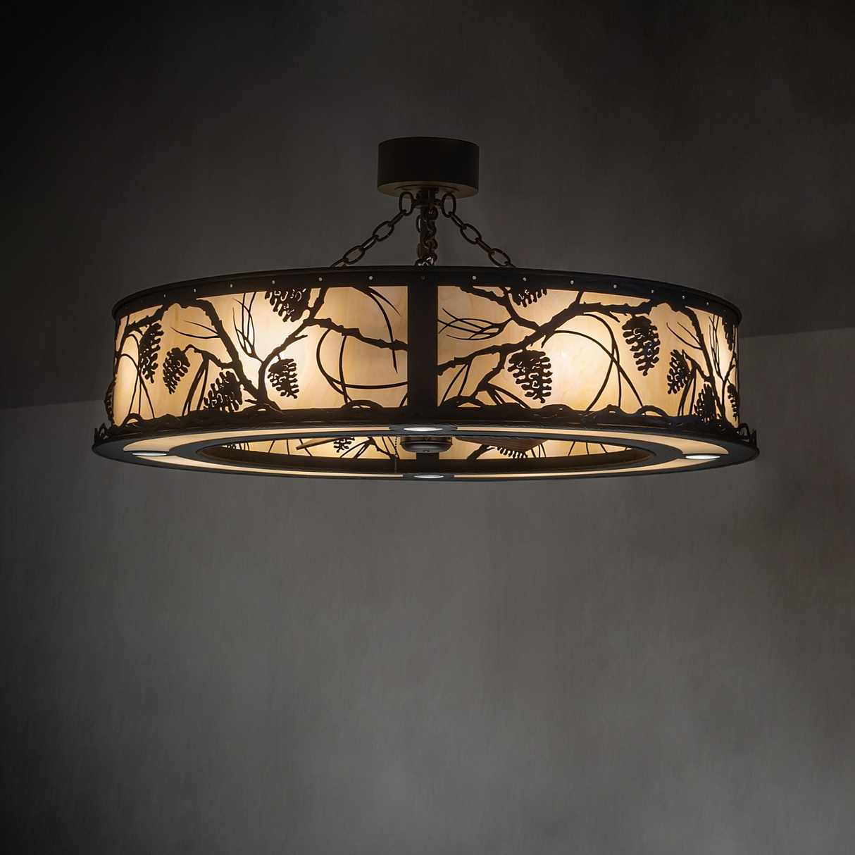 Whispering Pines Chandel-Air softly illuminating a rustic lodge interior.