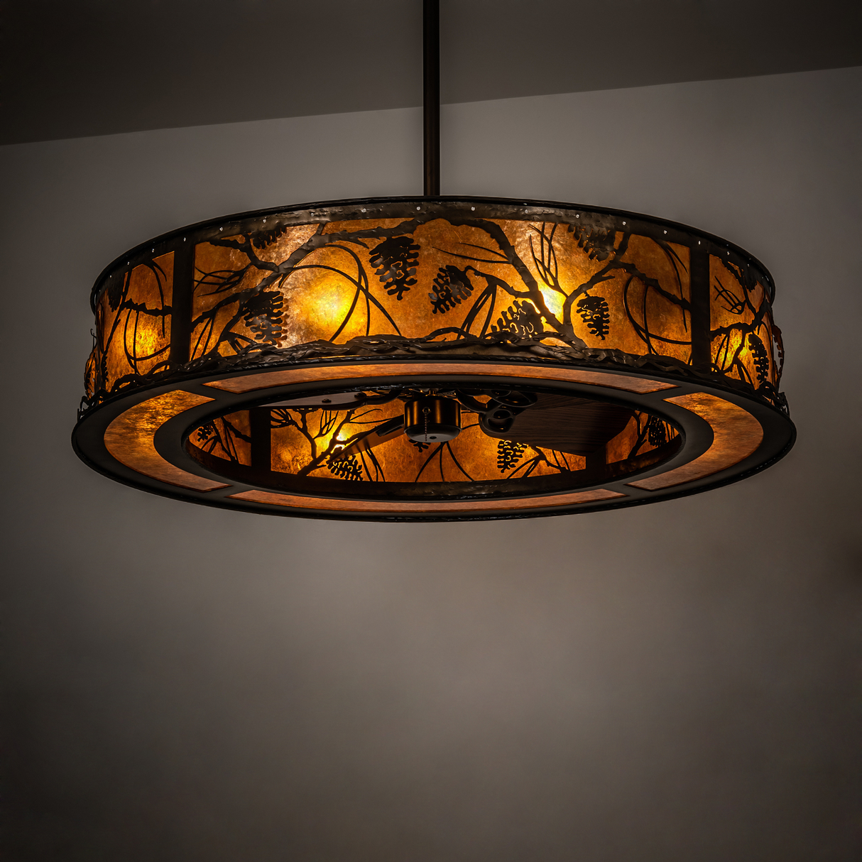 Ambient lit view casting warm amber light in room with pinecone design.