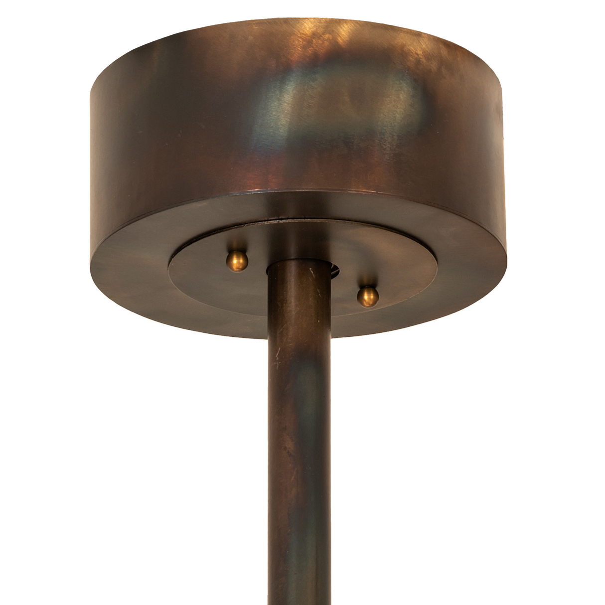 Closeup of ceiling canopy and downrod in burnished copper finish with smooth hardware detailing.