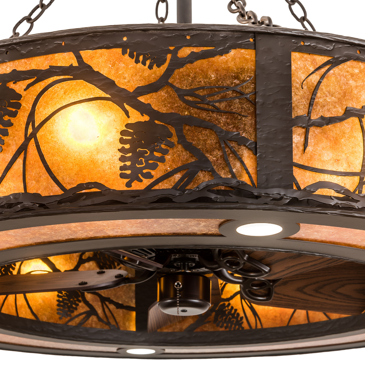 Close-up of pinecone branch design and glowing amber mica diffuser.